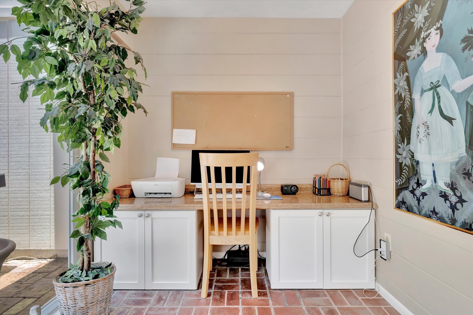 Your dedicated workspace awaits, complete with natural light, a peaceful corner desk, and a touch of greenery to keep you inspired throughout your stay.