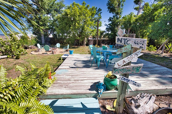 Soak up the Florida sunshine in your own tropical retreat, where vibrant garden paths lead to colorful lounge seating and shaded dining spots perfect for lazy afternoons.
