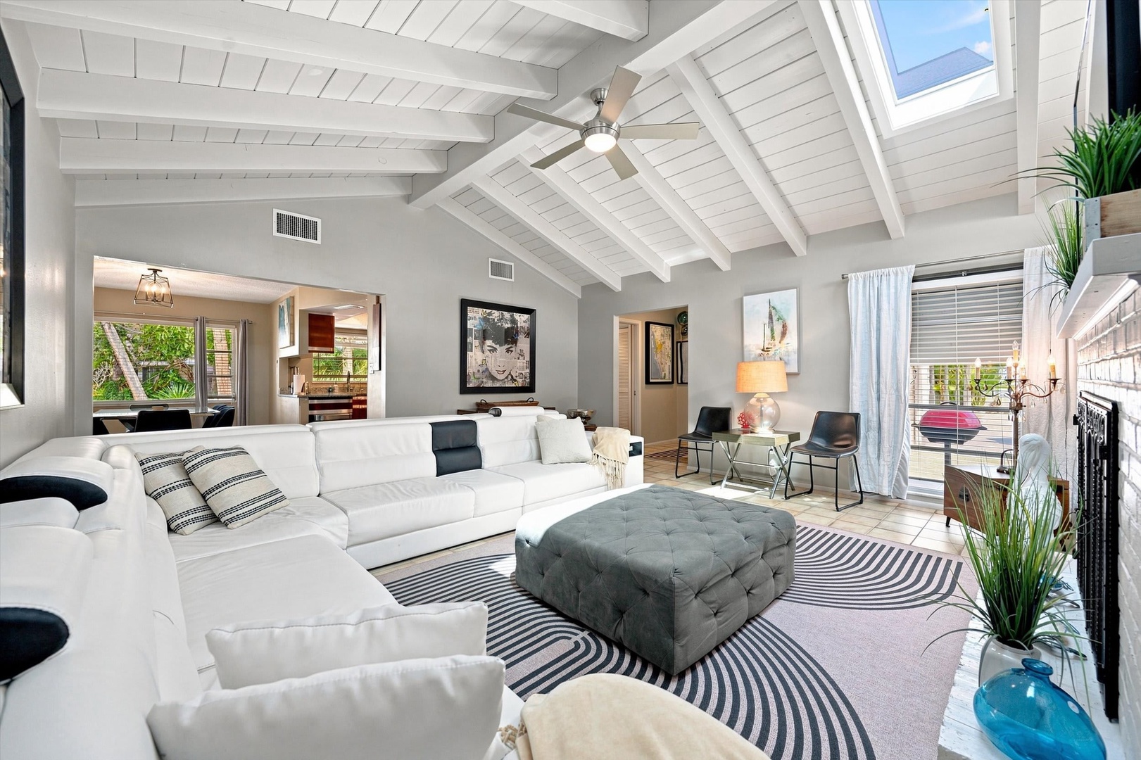 Sink into plush seating under soaring vaulted ceilings with exposed beams. Natural light pours through skylights and windows, creating your perfect retreat for relaxing after a day of adventure.