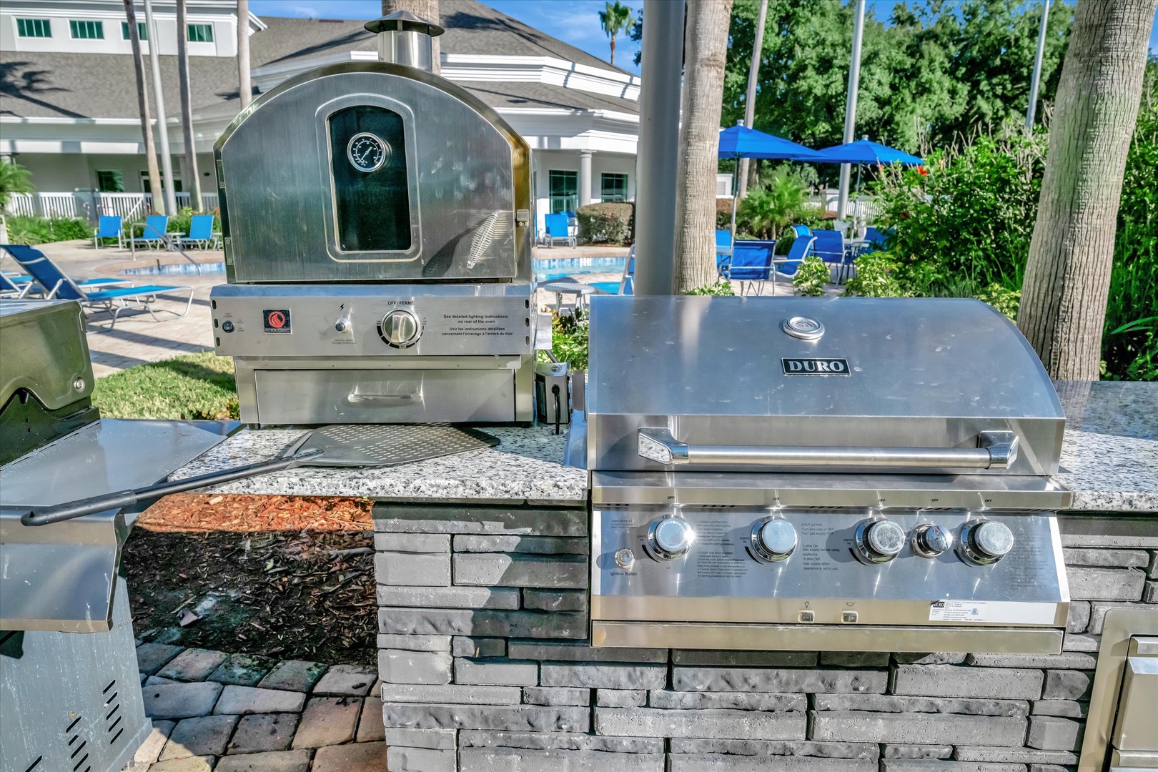 The property features an outdoor grilling station complete with built-in pizza oven, perfect for preparing memorable meals during your stay.