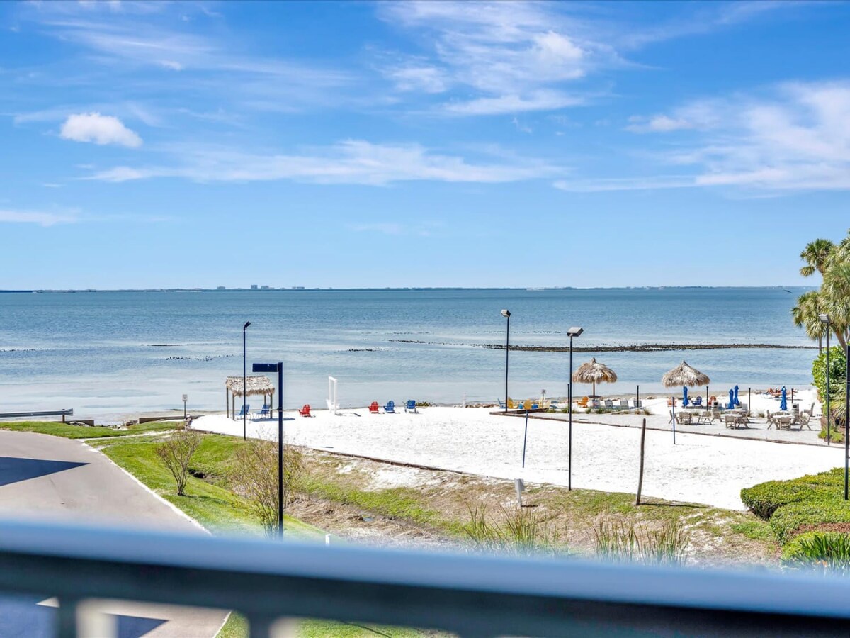 Step out onto your balcony and soak in this stunning beachfront view, where soft white sand meets calm turquoise water. Grab a seat under one of the thatched umbrellas and let the gentle Gulf breeze and endless horizon wash your worries away.