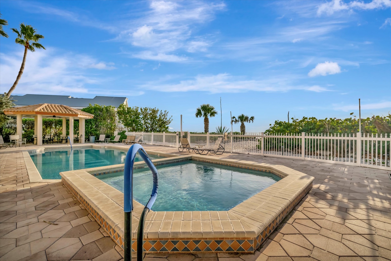 Take a dip under sunny skies or relax poolside with swaying palms and tropical breezes all around—your perfect escape awaits.