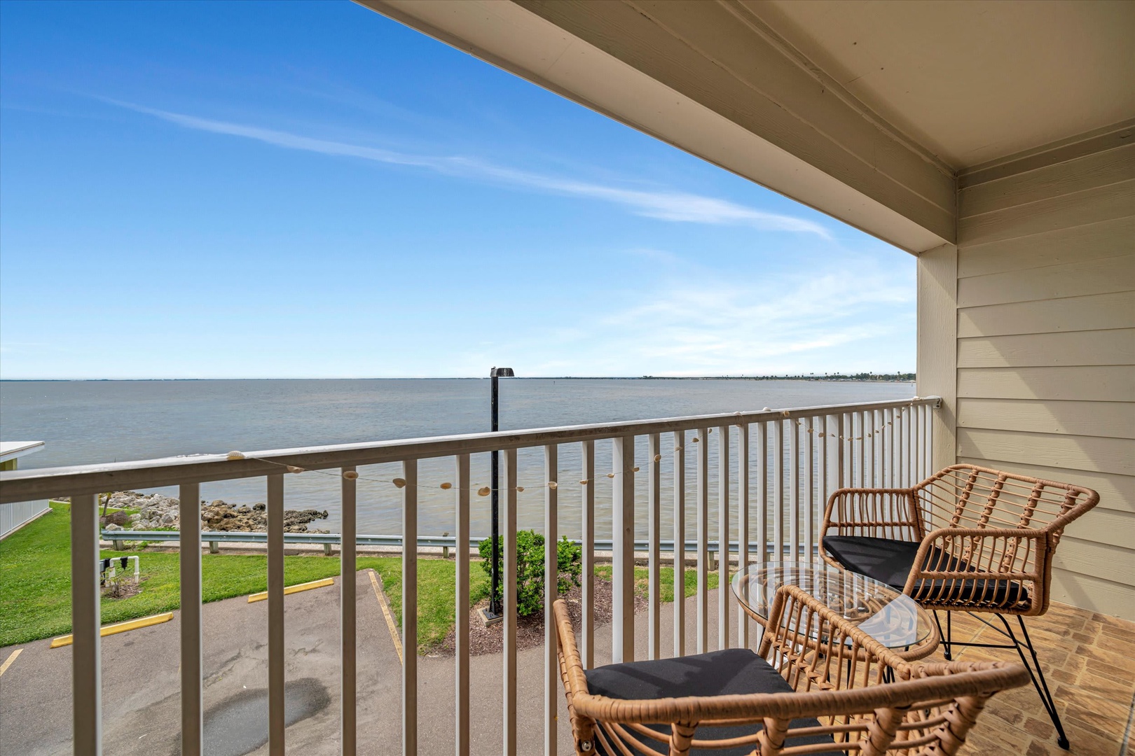 Picture yourself lounging here with your morning coffee, watching sailboats drift across the water. The gentle breeze and endless horizon create your perfect coastal escape.
