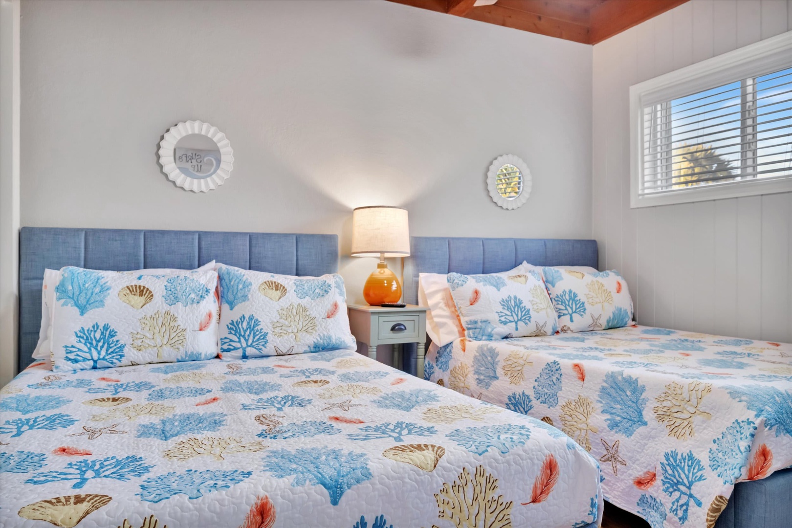 Drift off in comfort surrounded by serene coastal charm, where soft linens and soothing colors create your perfect seaside escape.