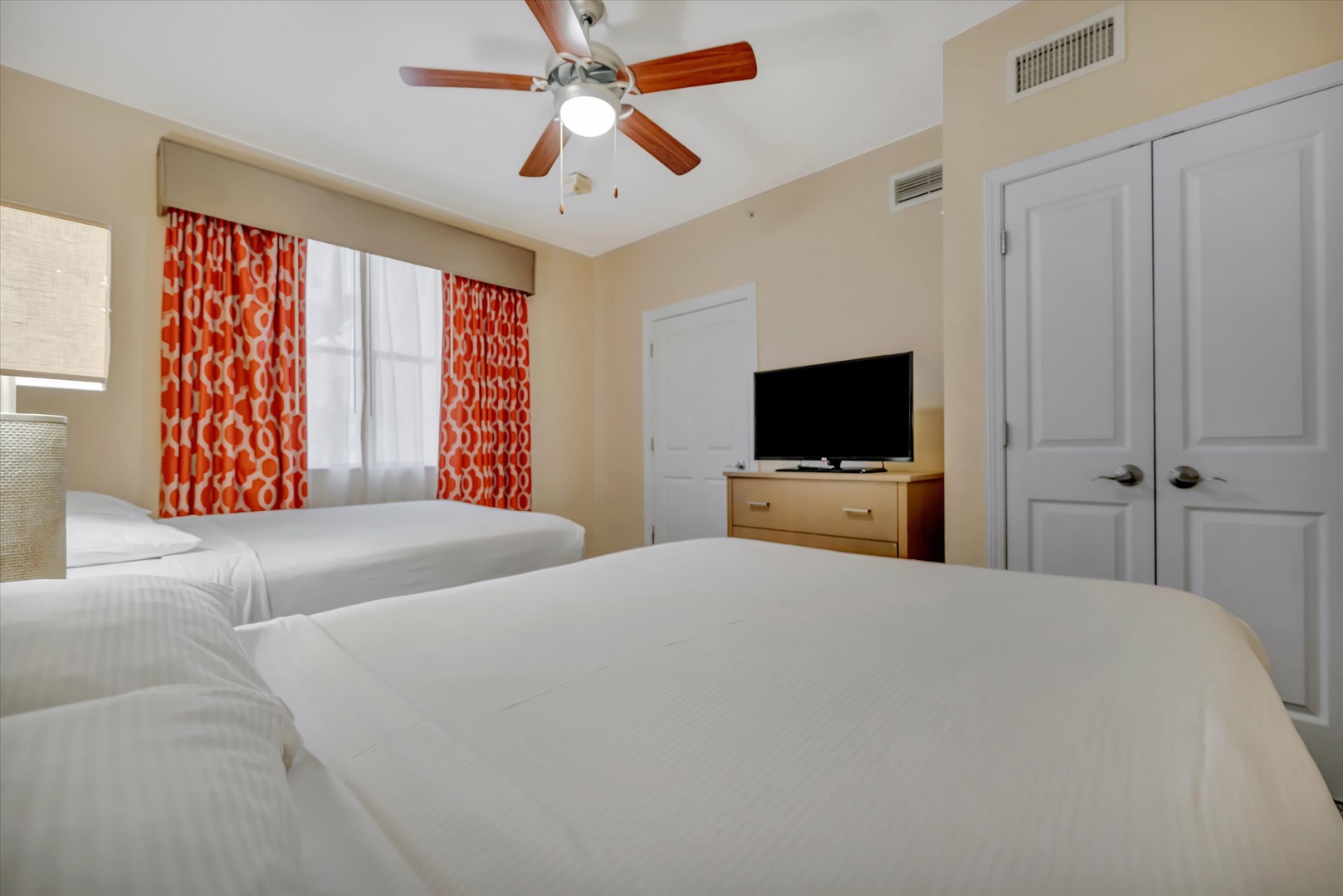 Relax in your bright bedroom with two plush beds, fresh linens, and cheerful pops of color. The ceiling fan and AC keep things comfortable year-round.