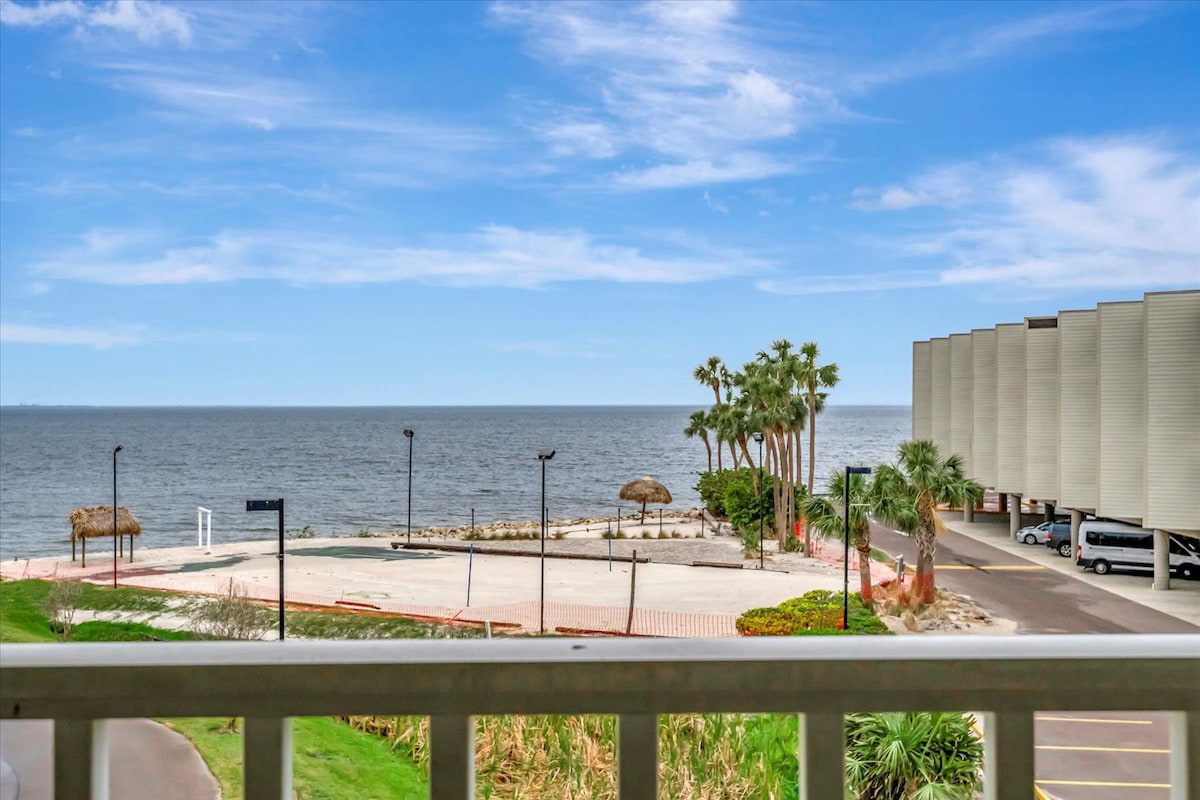Enjoy sweeping water vistas from your private balcony, where palm trees frame the horizon and the gentle sea stretches endlessly before you.