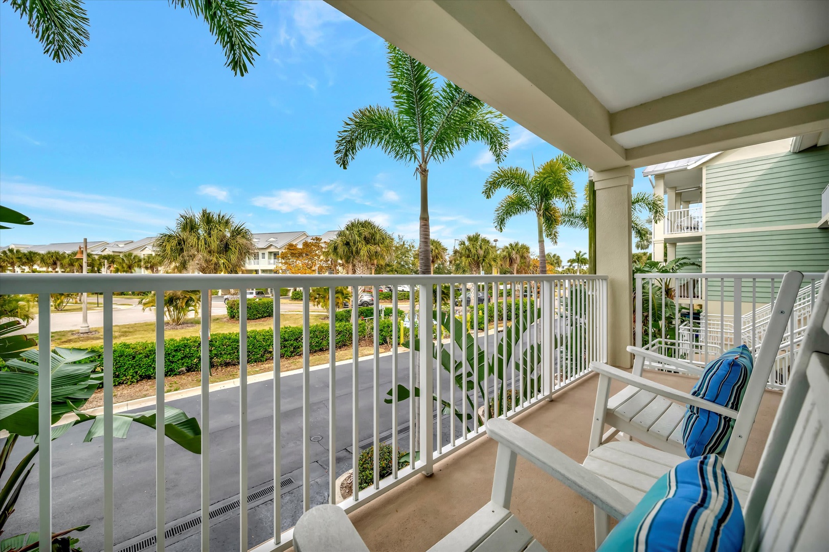 Step out onto your private balcony and soak in the tropical breezes, swaying palms, and peaceful neighborhood views—the perfect spot for morning coffee or evening relaxation.