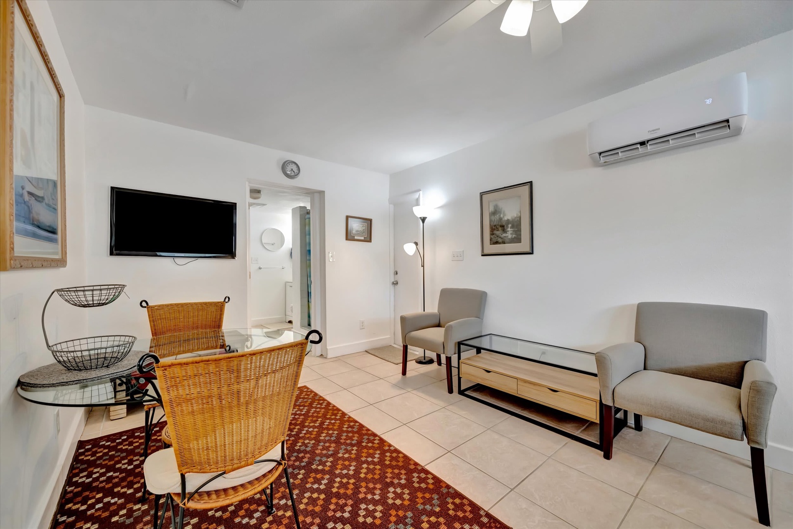 Step into your welcoming living space where comfort meets convenience. The neutral tones and cozy seating invite you to unwind after your adventures. Your climate-controlled retreat features all the essentials for relaxing evenings in.