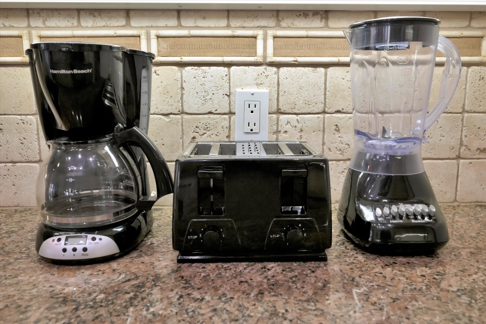 Your kitchen is stocked with everything you need to start the day—coffee maker, toaster, and blender ready for fresh smoothies or morning brews at your own pace.