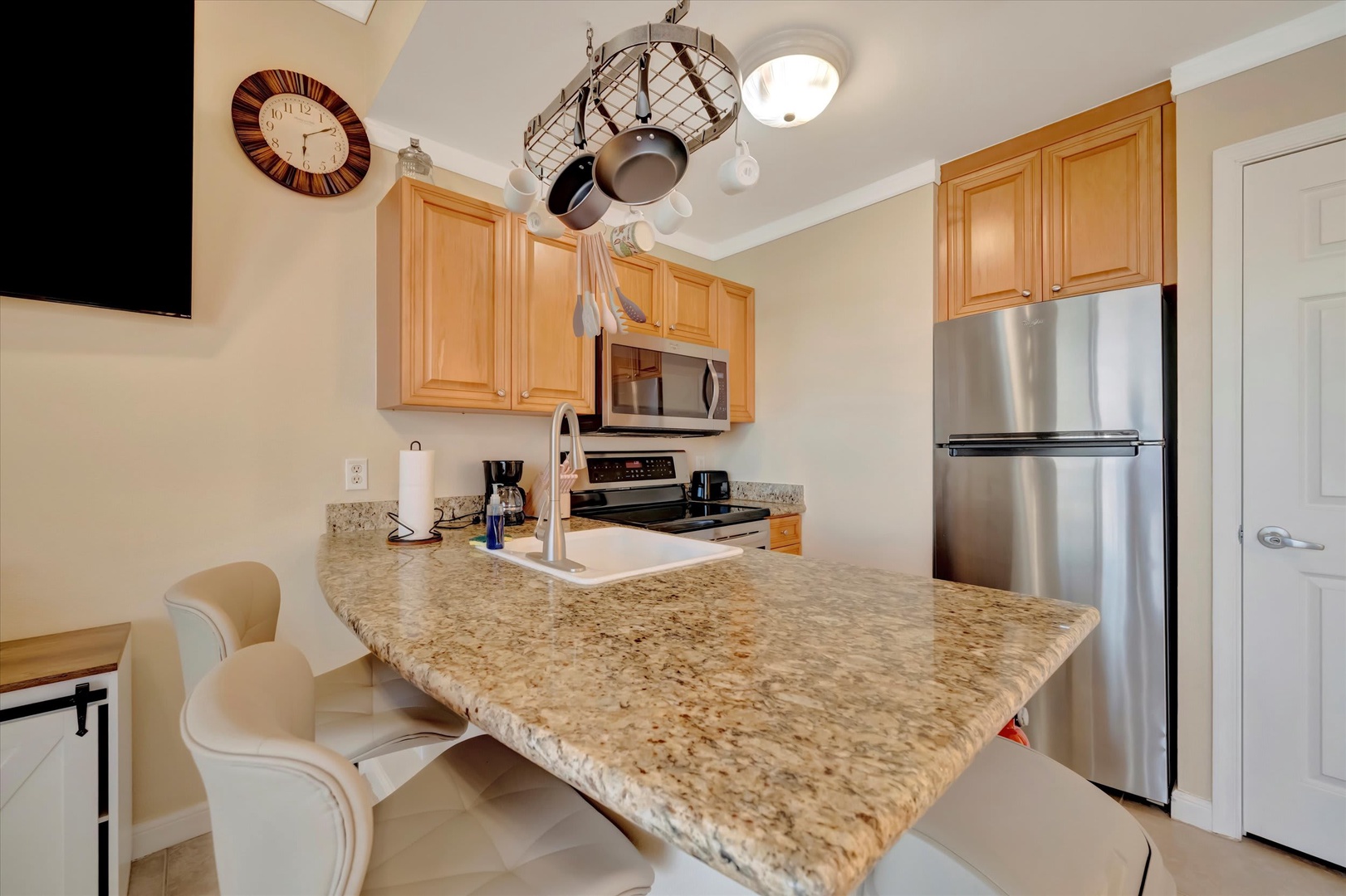Your fully equipped kitchen features granite countertops, stainless steel appliances, and everything you need to prepare meals during your stay.