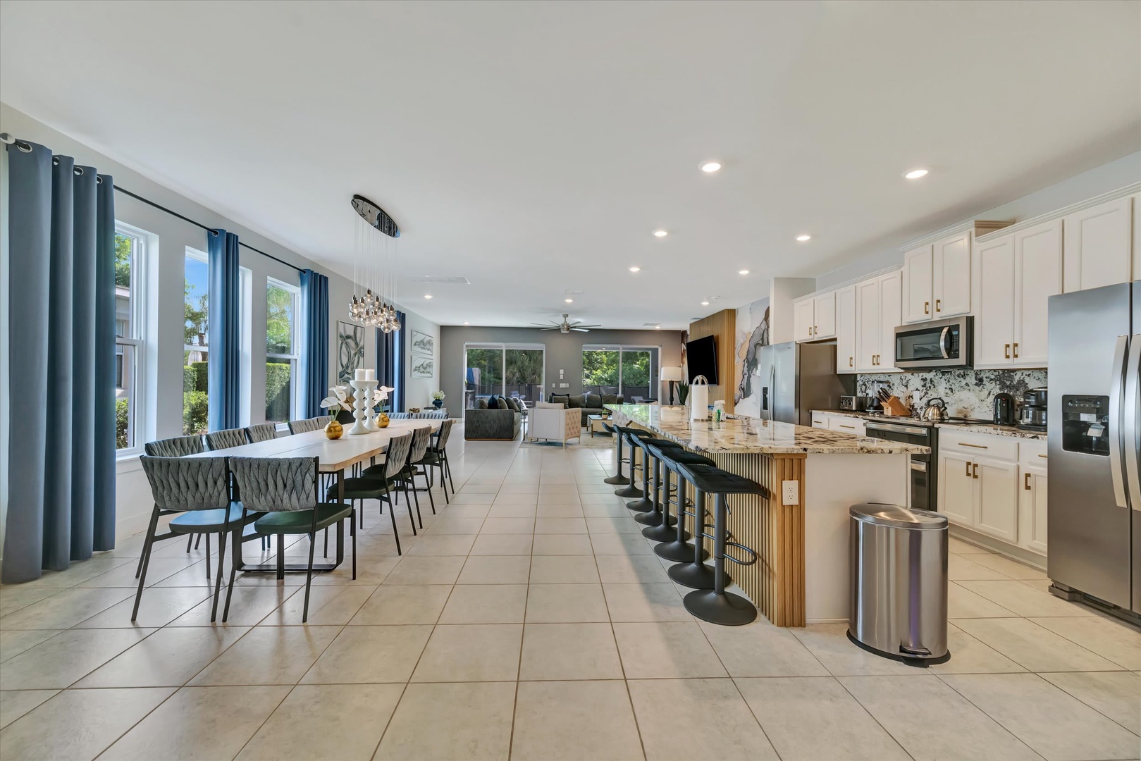 This stunning open-plan space flows seamlessly from dining to living, with a chef's kitchen and spacious island perfect for meals and gathering with your group.