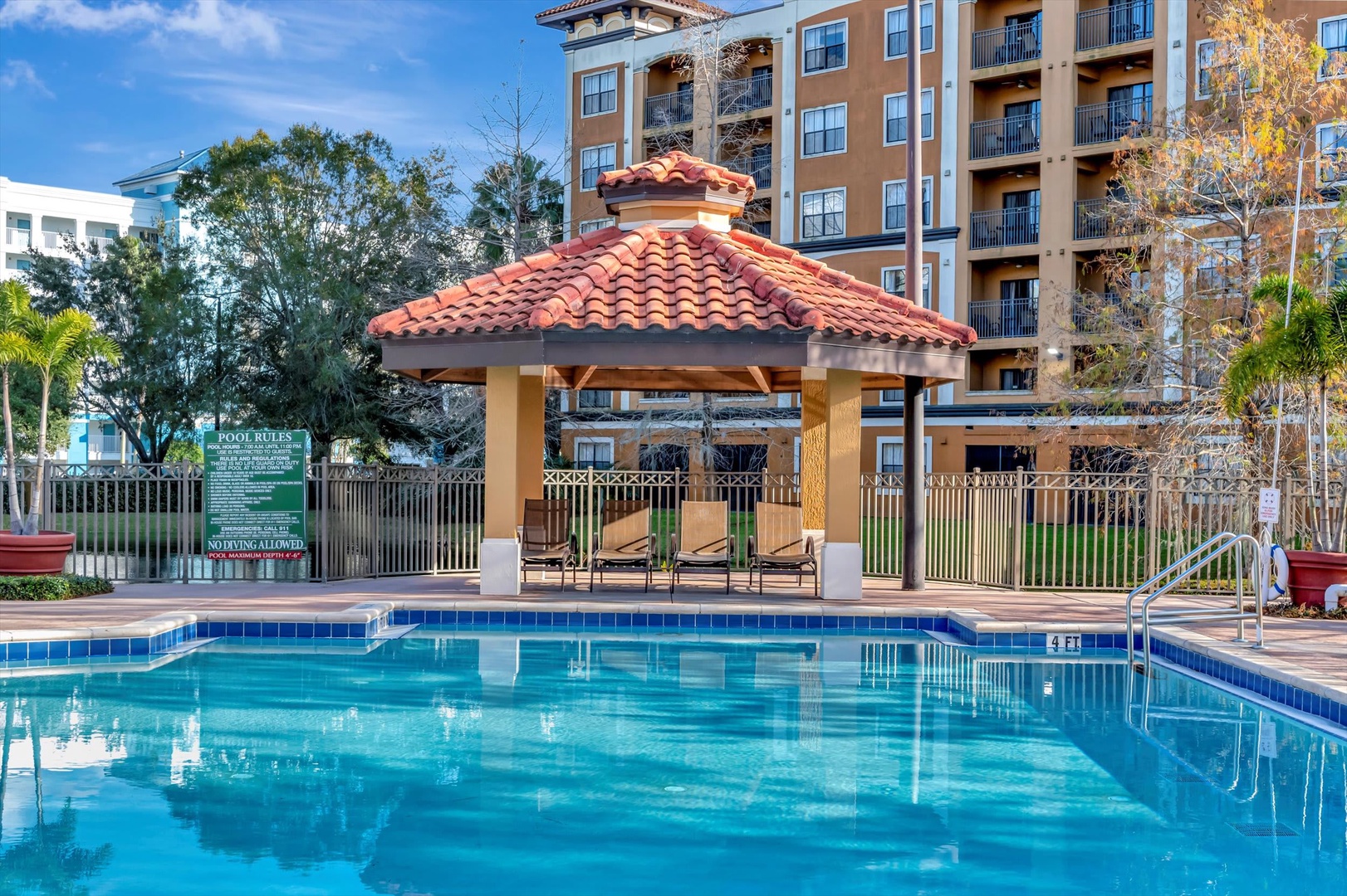 Your private oasis awaits under the sun—crystal-clear water, shaded lounging by the cabana, and palm-kissed breezes. Dive in and let the day melt away.