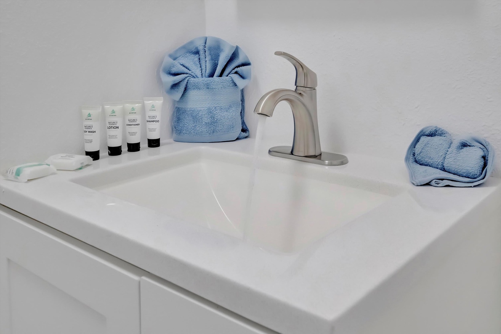Fresh towels and premium toiletries await you at your private sink, making your morning routine feel effortless and refreshing.