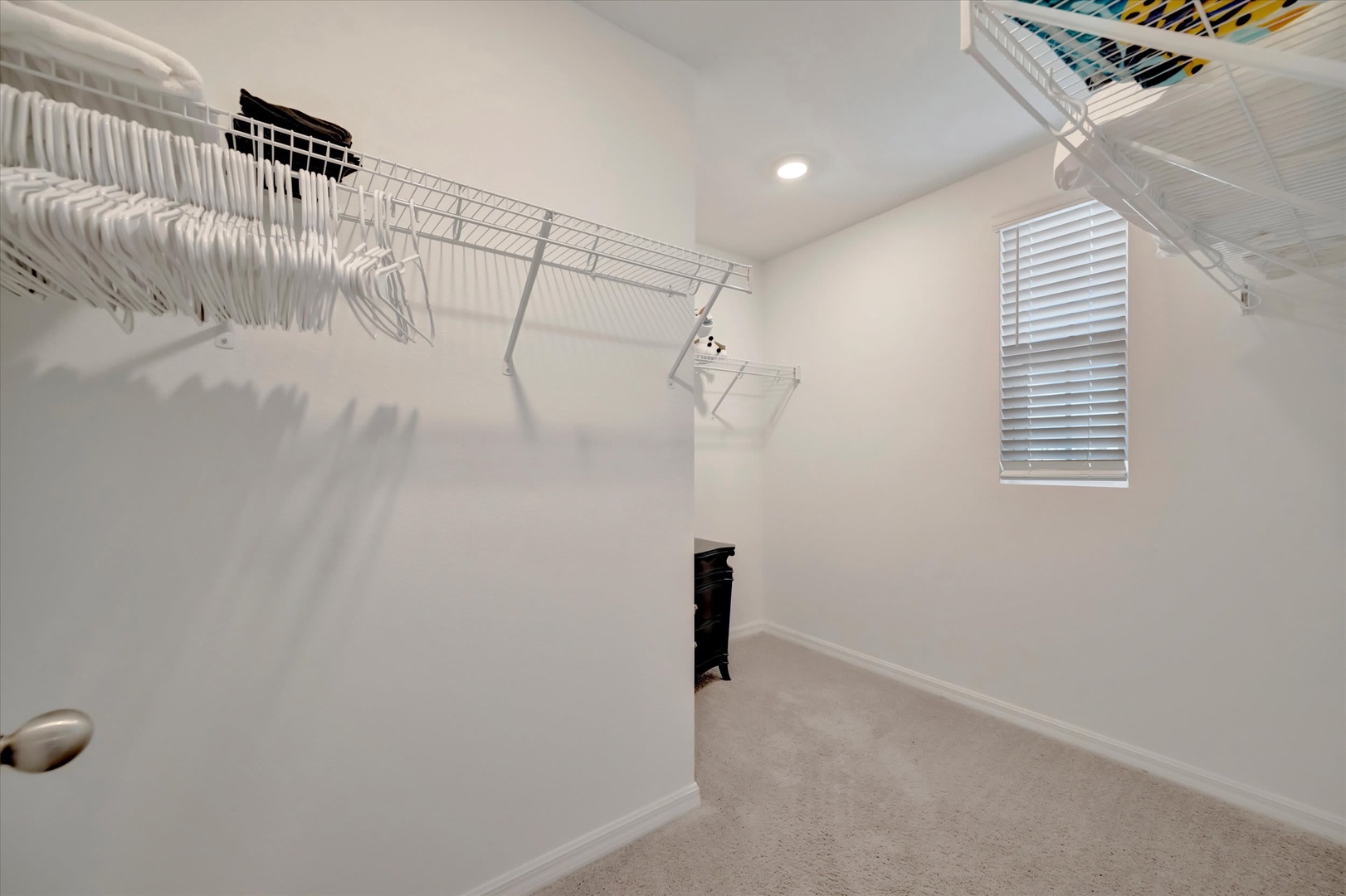 Your walk-in closet offers generous hanging space and built-in shelving, making it easy to stay organized throughout your stay.