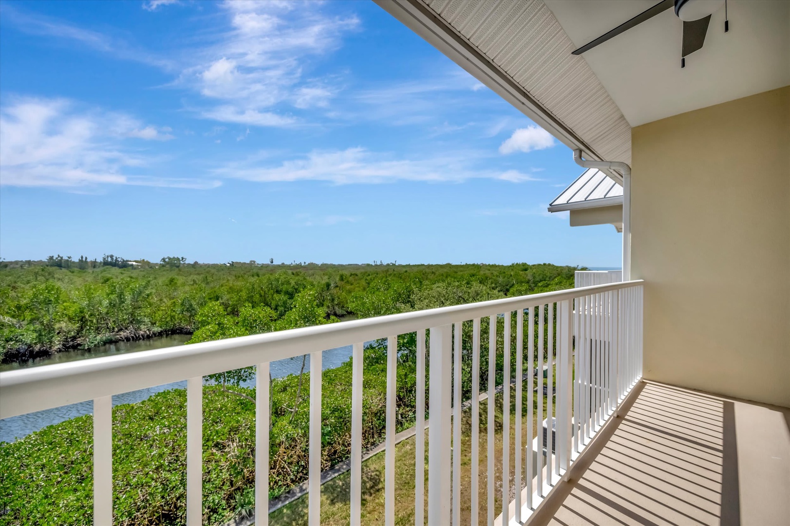 Step out onto your private balcony and breathe in the tranquil views of lush mangroves and peaceful waterways stretching beneath open skies.