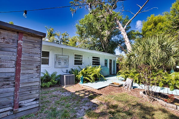 This charming coastal retreat sits nestled among lush tropical gardens and mature trees, offering a peaceful escape under brilliant blue skies and warm sunshine.
