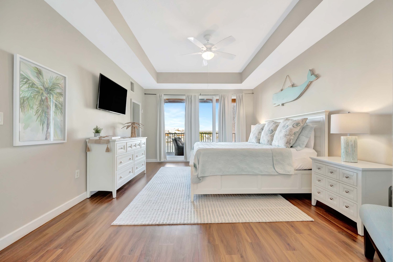 Wake up to soft coastal light in your serene bedroom retreat. The plush king bed invites restful sleep, while French doors open to your private balcony for morning coffee with a view.