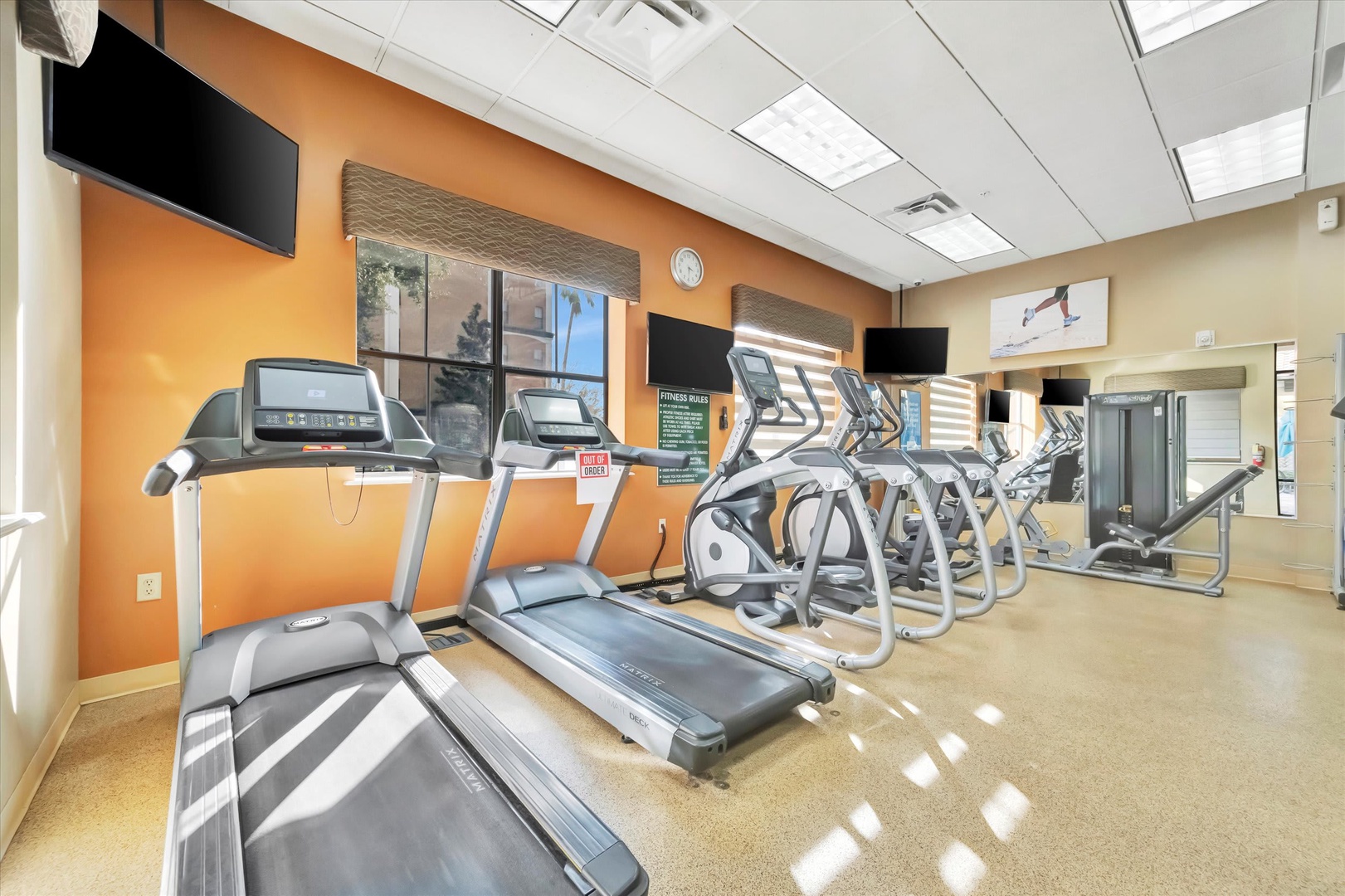 Stay active in the bright, fully-equipped fitness center with modern cardio machines and strength equipment—your wellness routine continues here.