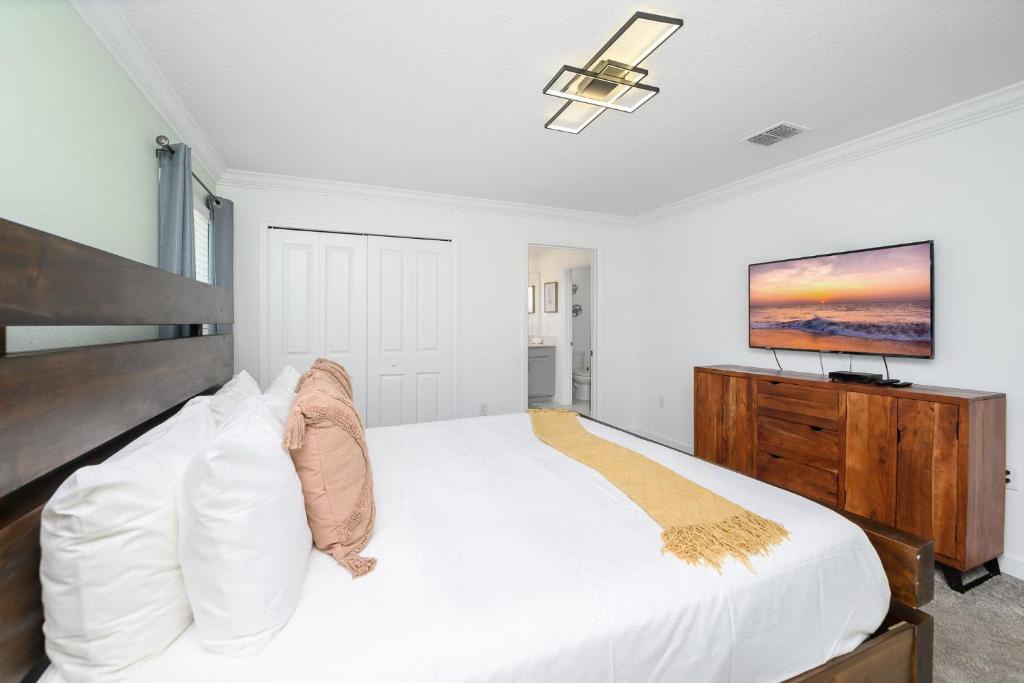 Sink into crisp white linens and unwind in your peaceful retreat, complete with stylish furnishings and an ensuite bathroom just steps away from your restful bed.