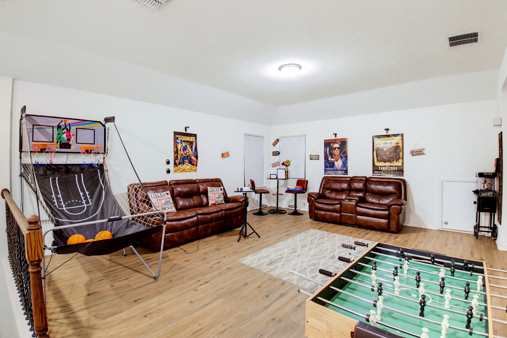 Your private game room awaits with arcade basketball, foosball, and plush leather recliners—perfect for friendly competition and downtime with your crew.