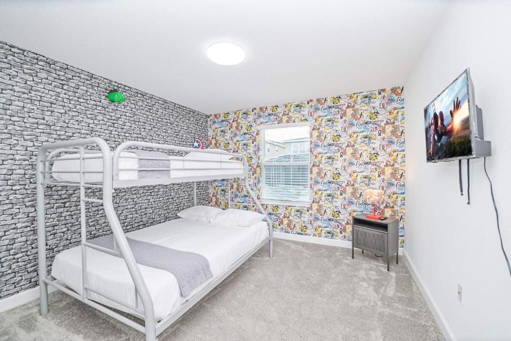 Your little ones will love the playful themed decor and comfortable twin bunks in this bright, fun bedroom—complete with entertainment for cozy evenings in.