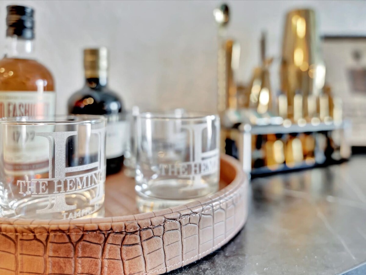 Enjoy a refined evening with signature cocktails and spirits arranged on elegant serving trays. Your stay includes a thoughtfully curated bar setup for effortlessly entertaining and unwinding.