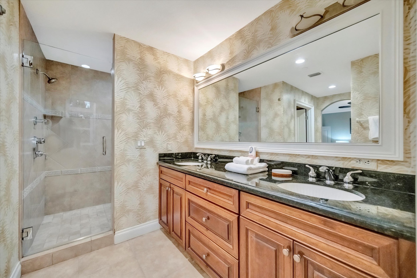 Step into your private spa-like retreat with dual vanities, a spacious walk-in shower, and elegant touches that make every morning feel like a luxury escape.