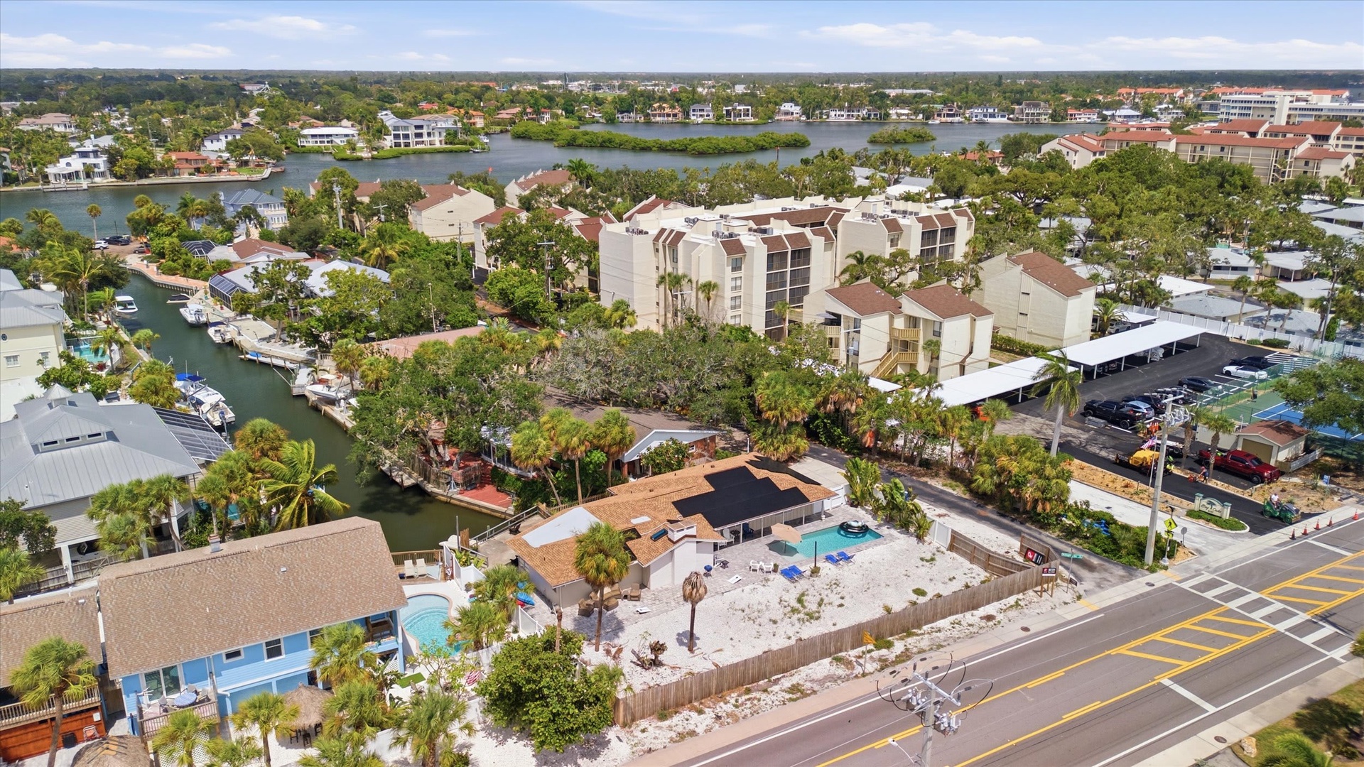 This waterfront vacation rental sits in a serene coastal neighborhood, surrounded by lush greenery and scenic canals. The property features a private pool and backyard oasis, perfect for relaxing after exploring nearby beaches and attractions.