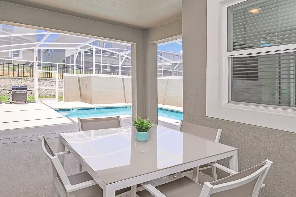 Enjoy your morning coffee or casual meals overlooking your private screened pool. This shaded lanai offers a peaceful spot to relax while soaking in the Florida sunshine.