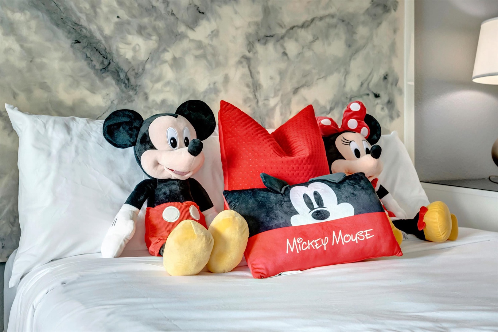 Sink into plush pillows and cozy bedding in a space where playful charm meets modern comfort—perfect for your family getaway.