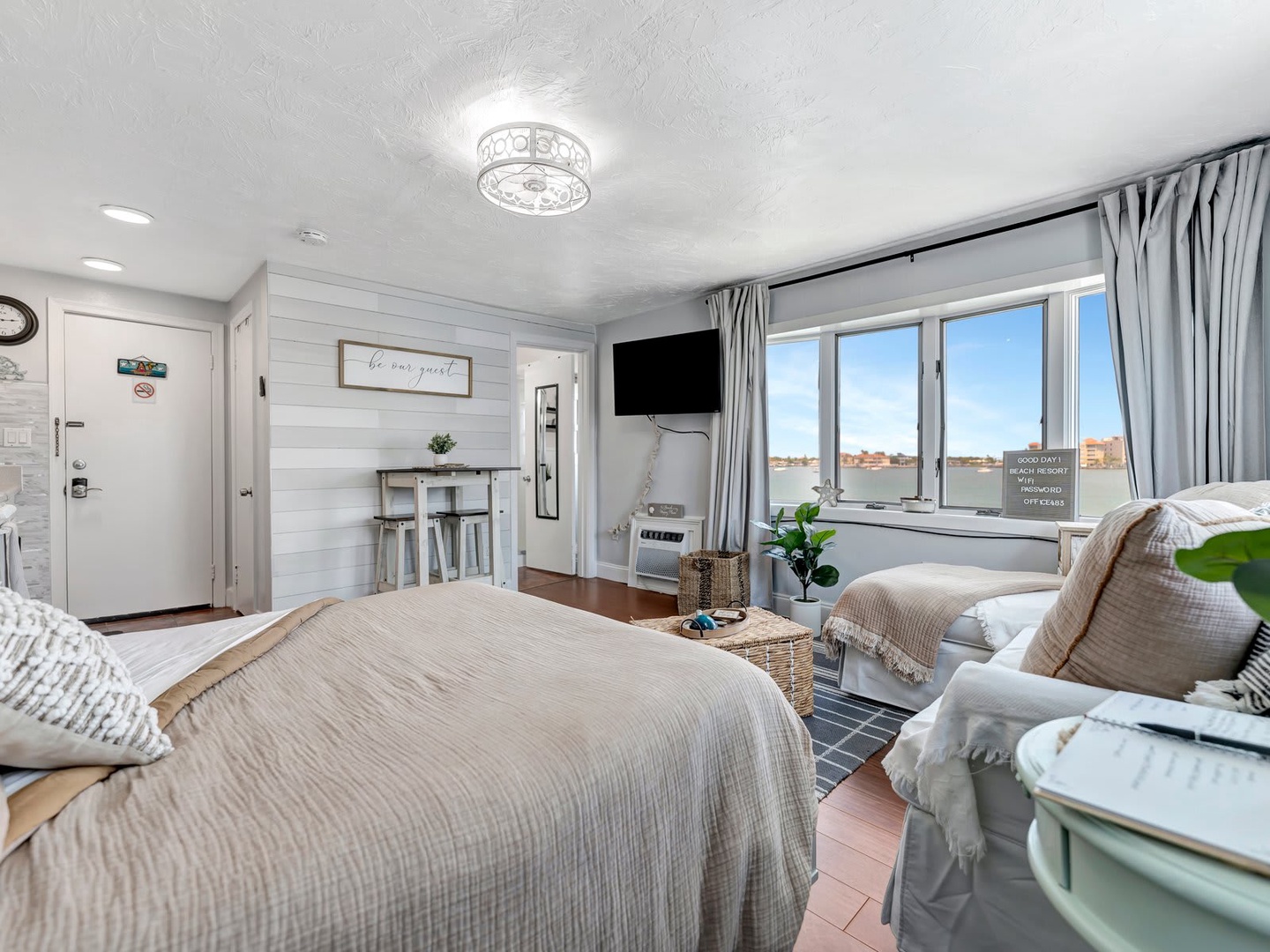 Sink into soft linens and let natural light fill your cozy retreat. The city unfolds outside your window, while inside feels like a peaceful escape with warm textures and thoughtful touches throughout.