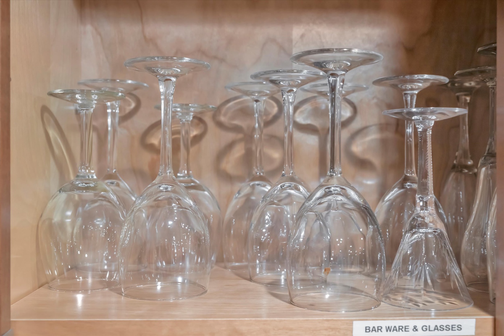 Neatly arranged stemware awaits your evening toast. These sparkling wine glasses stand ready to add elegance to your celebrations, whether you're unwinding after a day of adventure or hosting friends.