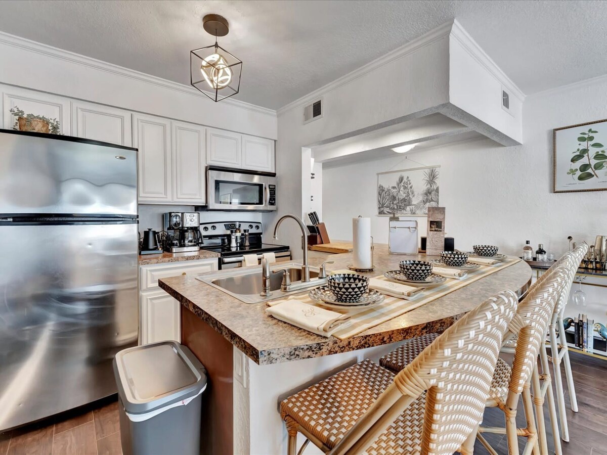 Step into your bright, open kitchen where morning coffee and home-cooked meals come to life. The island seating invites you to gather with friends while sunlight streams through the space, making every moment feel warm and welcoming.
