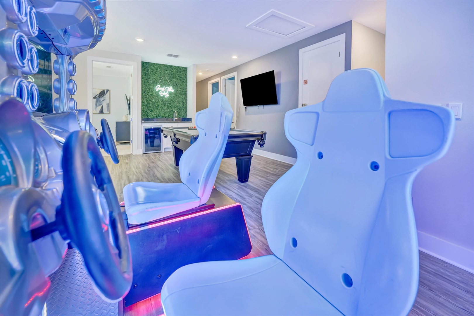 Your private game room awaits with racing simulators, pool table, and arcade fun—perfect for friendly competition after a day exploring the area.