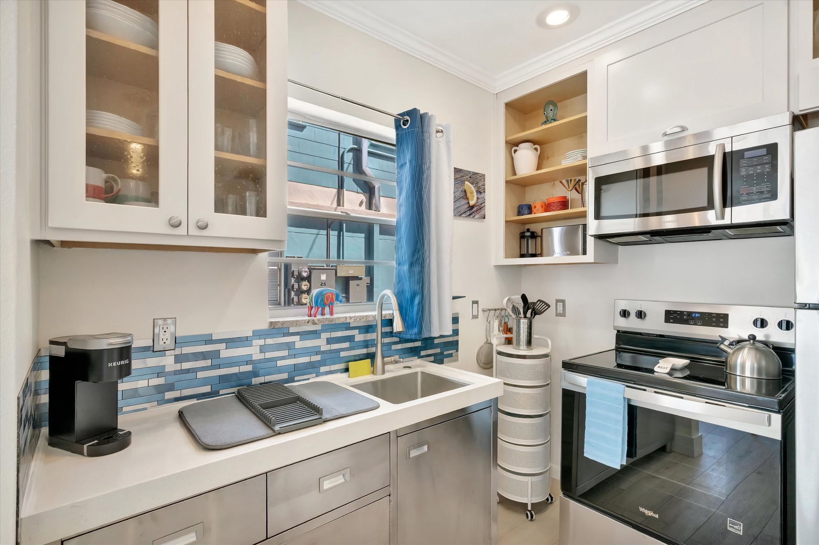Step into your bright, well-equipped kitchen with cheerful coastal touches, modern appliances, and everything you need to create memorable meals during your stay.