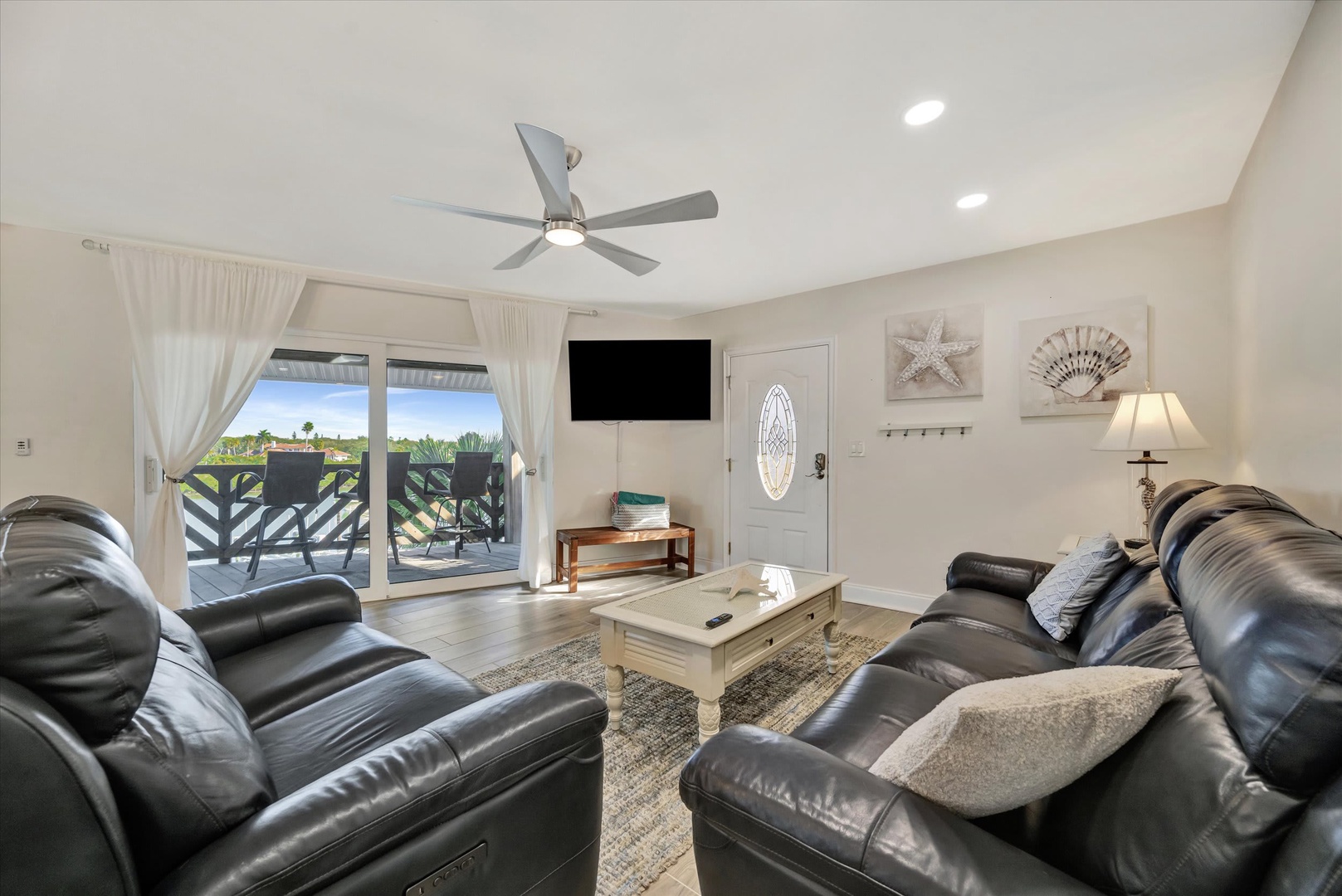Sink into plush leather seating and let the coastal charm soothe your soul. Breezy balcony doors, beach-themed décor, and abundant natural light create your perfect retreat after sun-soaked adventures.