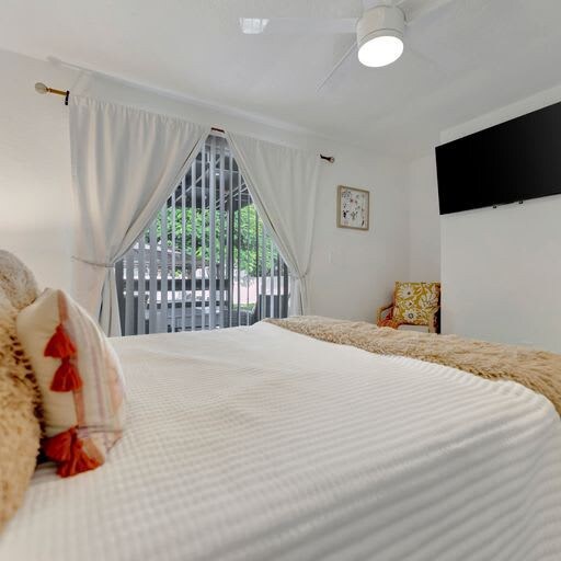 Drift off in your serene bedroom, where soft linens and gentle natural light create the perfect sanctuary for restful sleep after a day of exploring.