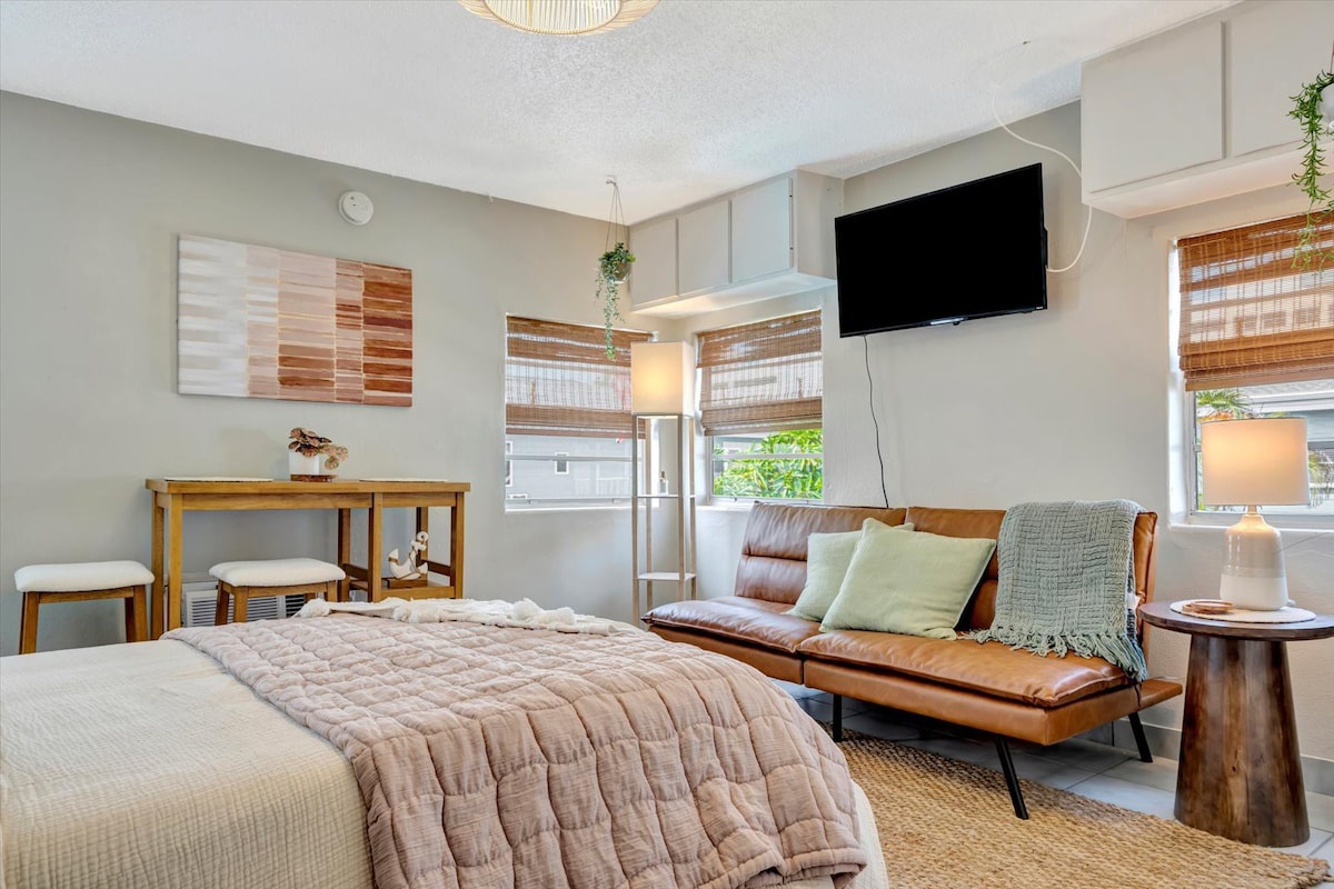 Sink into the plush bed and unwind on the leather daybed after your adventures. Natural light fills your space through bamboo shades, while plants and warm wood tones create a serene, peaceful retreat.