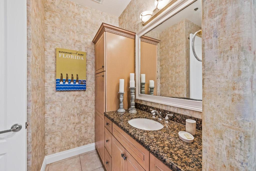 Refresh in your private bathroom with a granite vanity, ample storage, and coastal charm that makes every morning feel like a vacation.