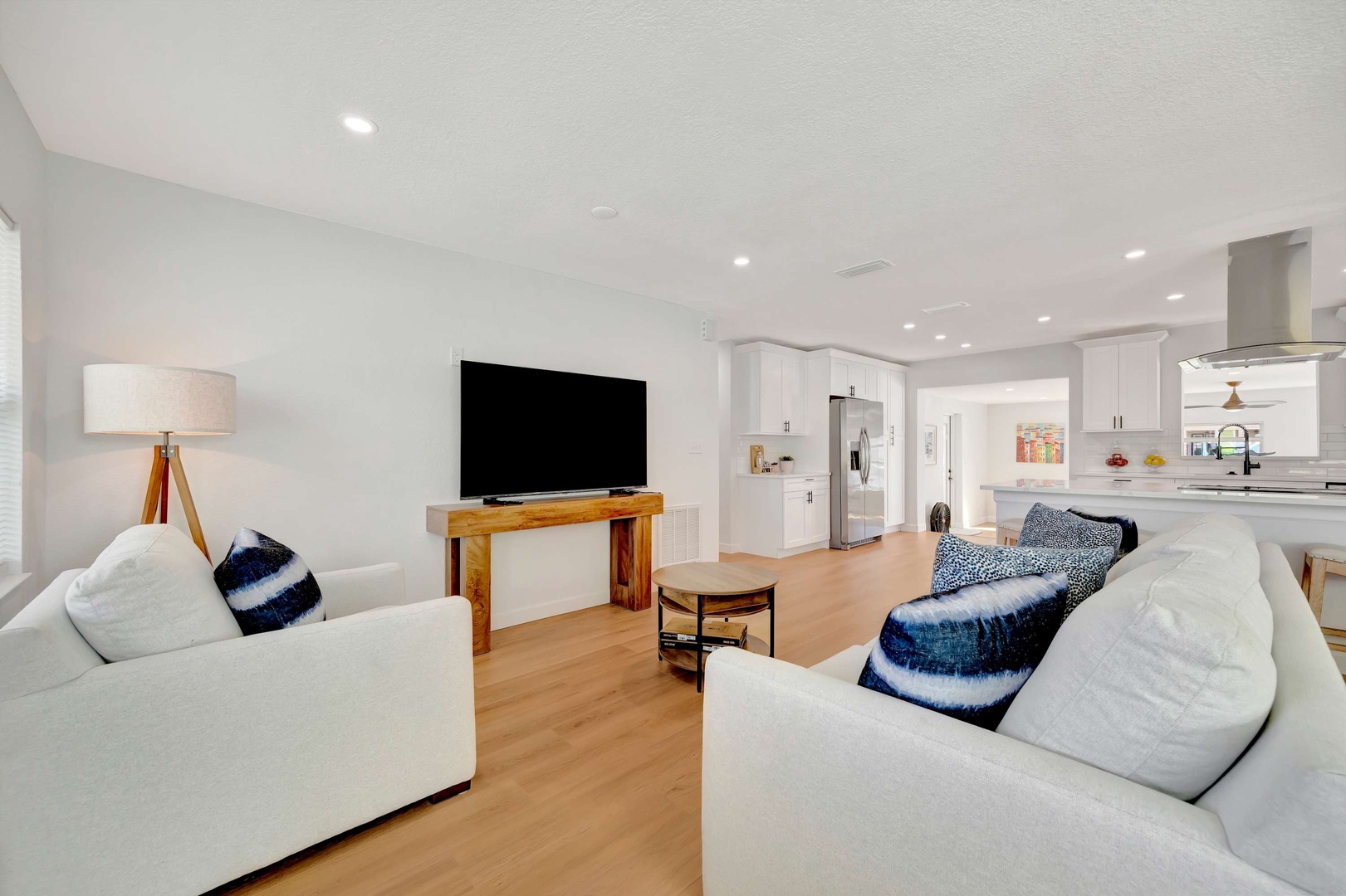 Relax in your bright, open-concept living space with plush seating and a modern kitchen just steps away—perfect for unwinding or gathering with loved ones.