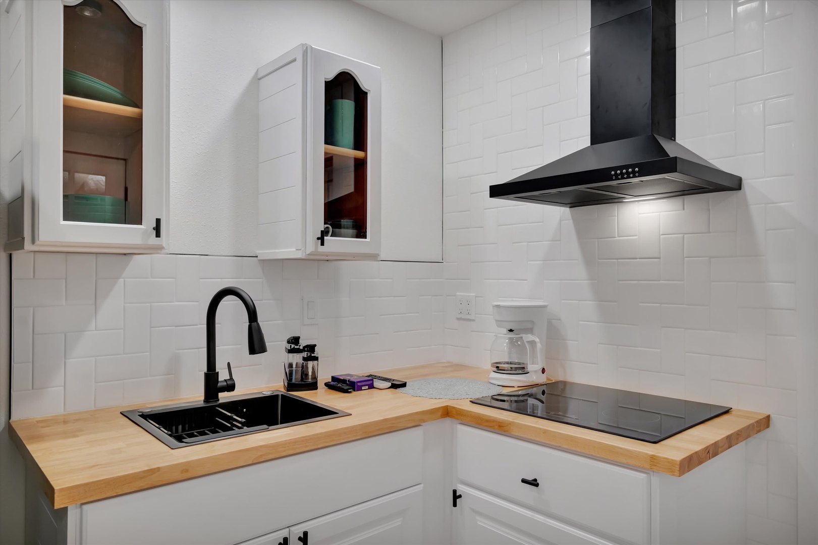 Your fully equipped kitchen awaits with modern appliances and warm butcher-block countertops, ready for you to prepare meals just the way you like them in your home away from home.