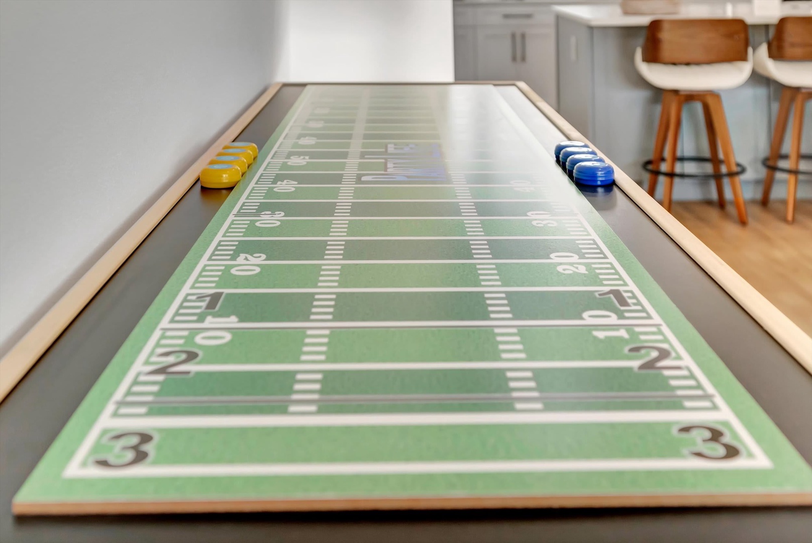 Game day excitement awaits at your custom shuffleboard table—perfect for friendly competitions and creating unforgettable memories with your crew.