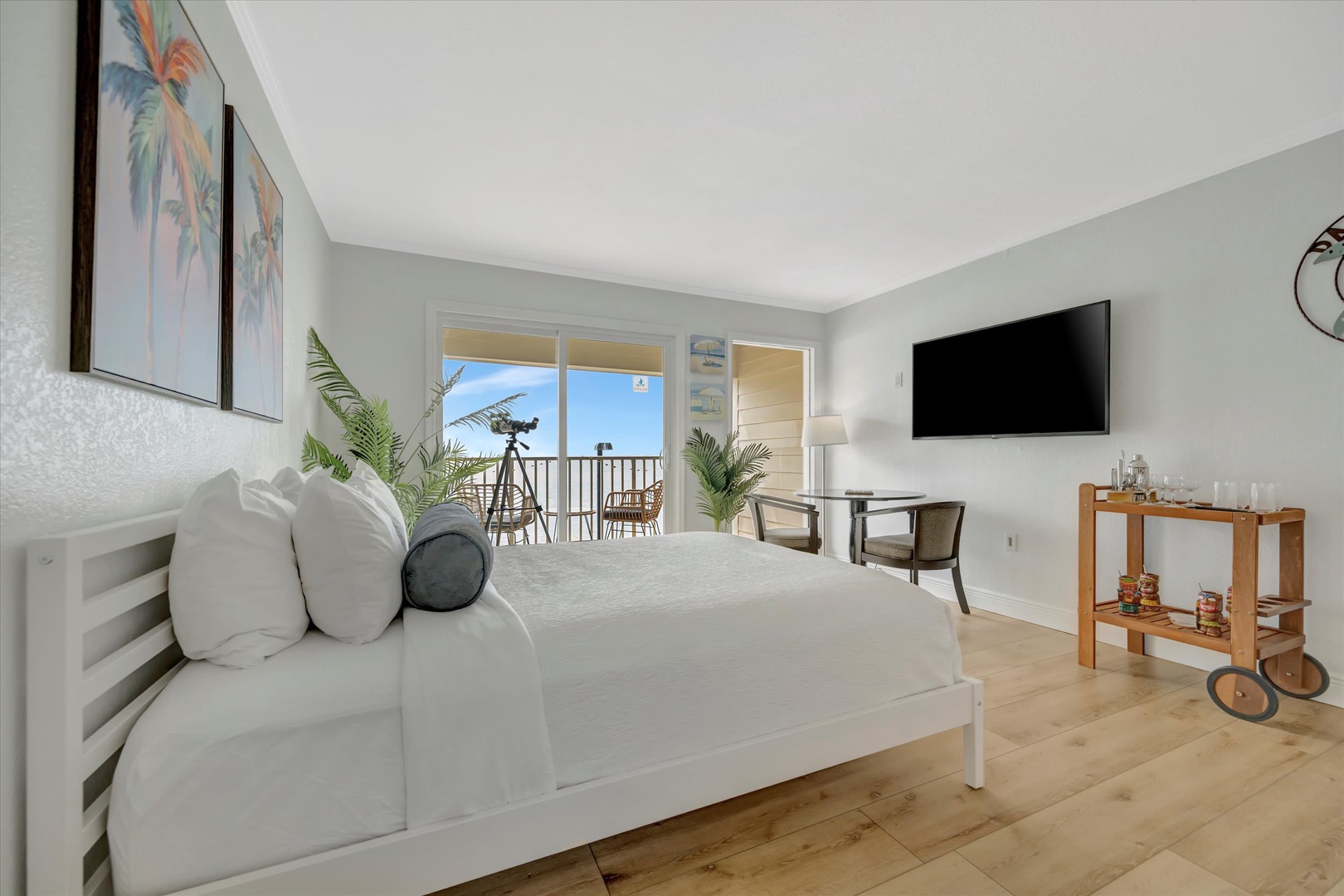Wake up in this serene coastal bedroom where soft linens and tropical touches greet you each morning. Step out to your private balcony and let the breeze set the tone for your day.