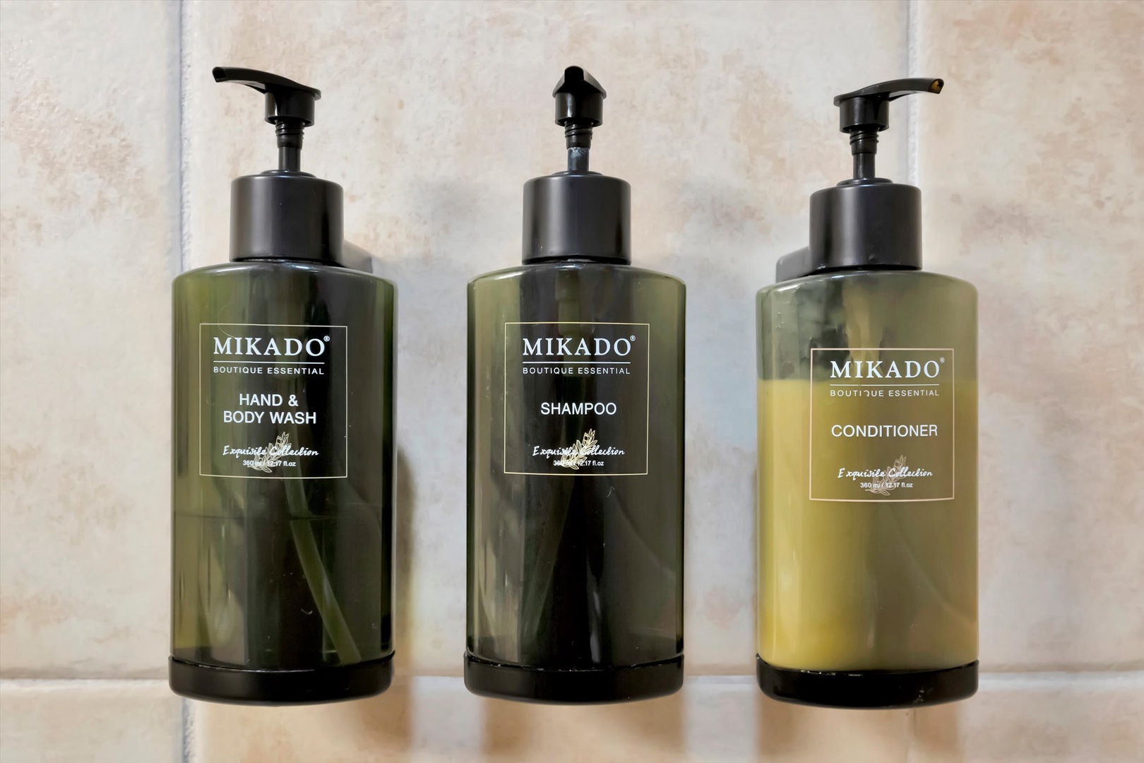 Your bathroom is stocked with boutique essentials—shampoo, conditioner, and hand & body wash in sleek pump bottles—making it easy to settle in and refresh after a day of exploring.
