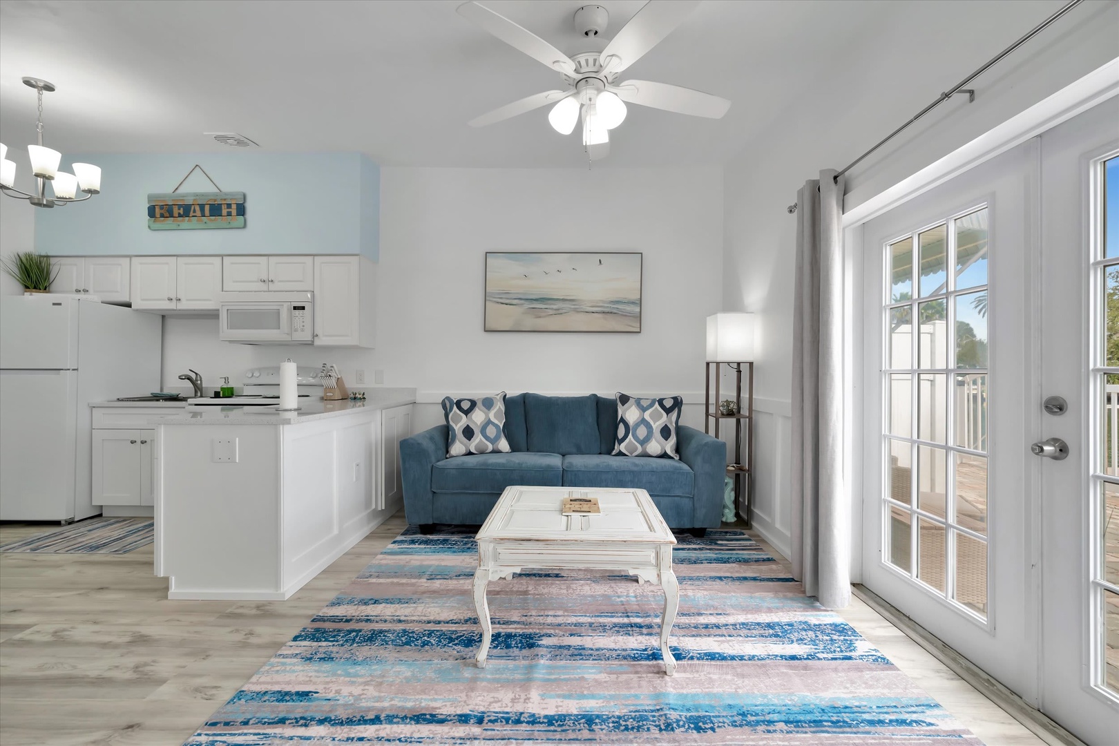 Settle into your bright, open living space with coastal charm and all the comforts of home. Your fully equipped kitchen flows seamlessly into the inviting lounge, perfect for unwinding after a day of adventure.