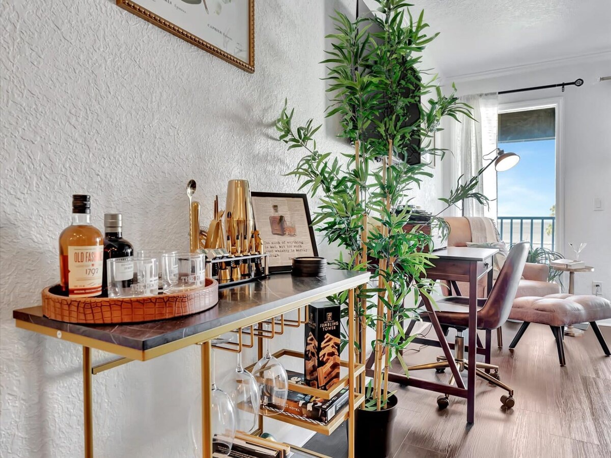 Unwind in a thoughtfully designed workspace that flows into your relaxing living area, where lush greenery and modern style create the perfect balance for work and leisure.