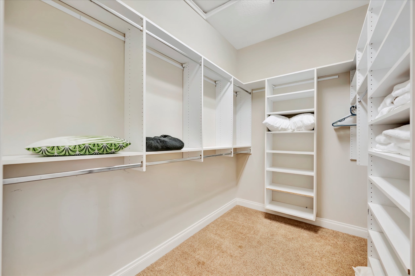 Your spacious walk-in closet offers generous storage with custom shelving and hanging space, keeping your wardrobe perfectly organized throughout your stay.