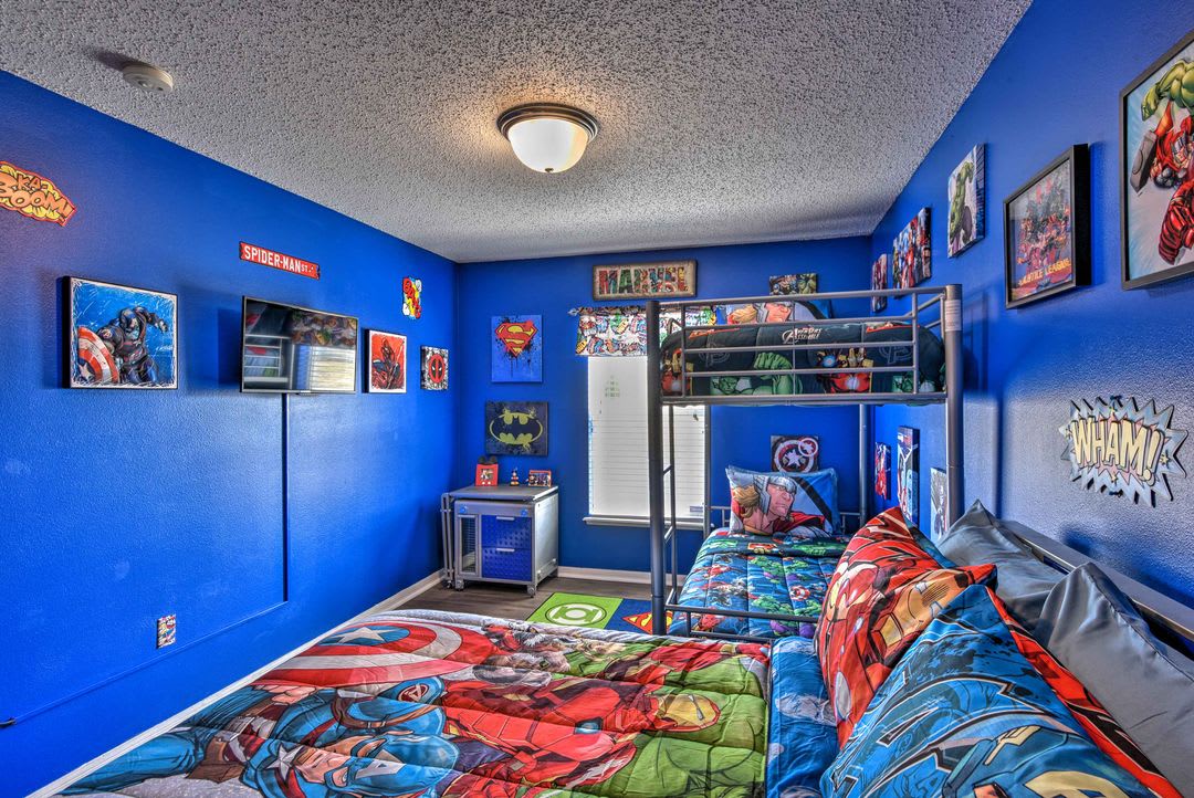 Step into your superhero headquarters! Bold blue walls, action-packed bedding, and comic book-themed décor create an exciting, imaginative space where kids can dream big and play hard.