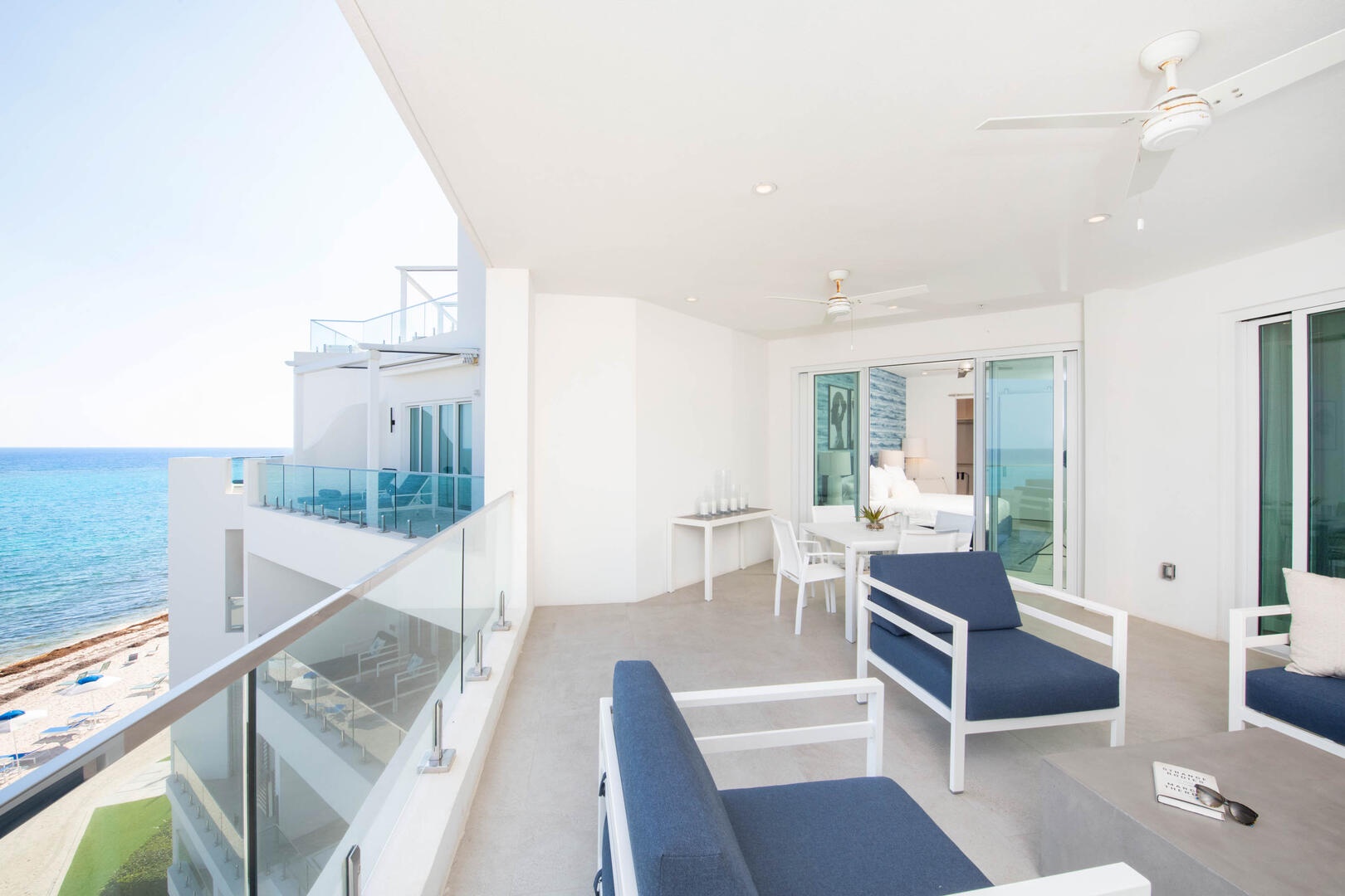 Furnished balcony with plenty of seating to soak up the ocean views.
