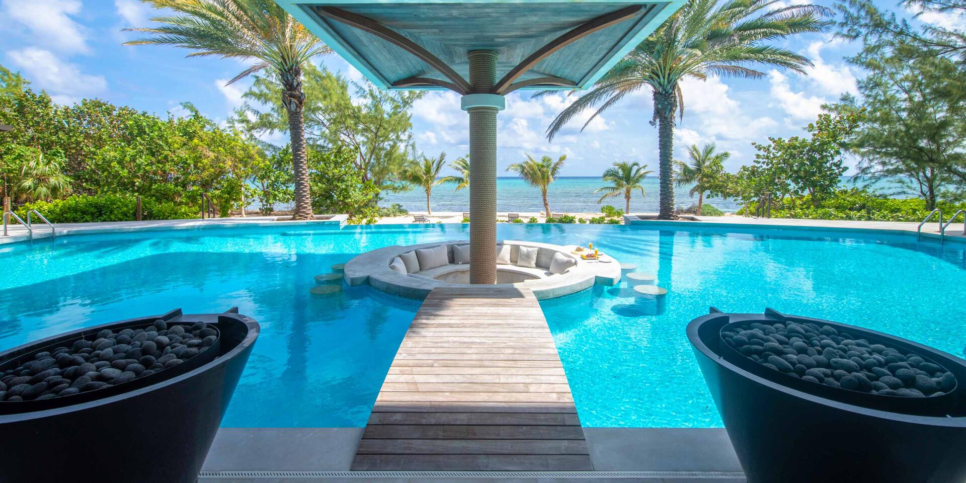 Welcome to Turtle Beach, a 6-bedroom gated estate with micro-resort vibes including a deluxe beachfront pool with sunken lounge and swim up bar.
